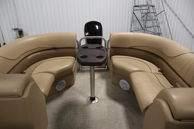 Slide: The Image of Luxurious seating on 2021 Lowe SS 230 WT pontoon boat with beige upholstery. - 30