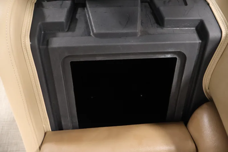 Slide: The Image of Storage compartment in 2021 Lowe SS 230 WT boat with beige seating. - 35