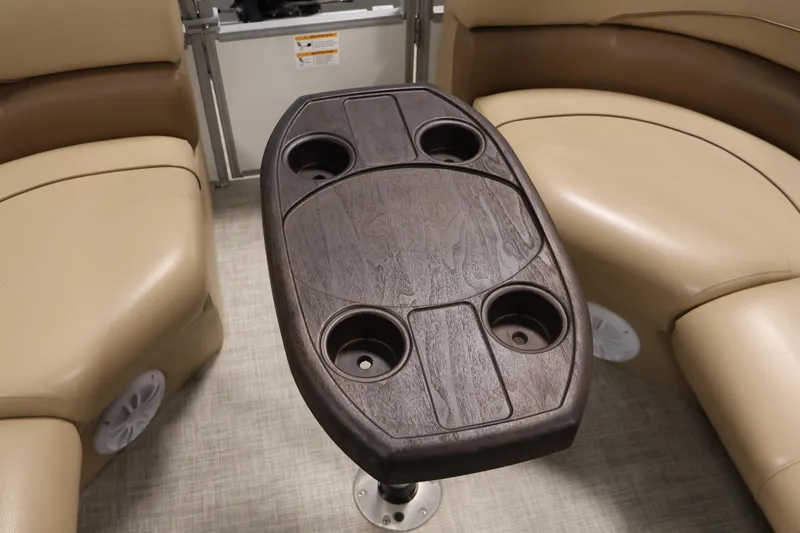 Slide: The Image of Lowe SS 230 WT 2021 boat interior with wooden table and cup holders. - 37