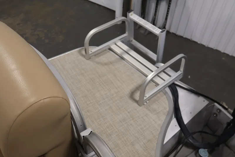Slide: The Image of 2021 Lowe SS 230 WT boat interior with beige seating and aluminum ladder. - 38