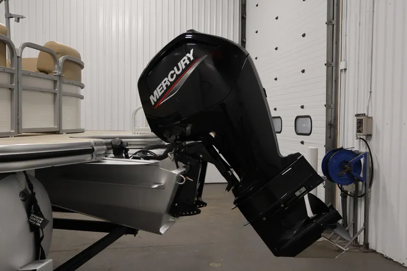 Slide: The Image of 2021 Lowe SS 230 WT pontoon boat with Mercury outboard motor in a garage. - 40