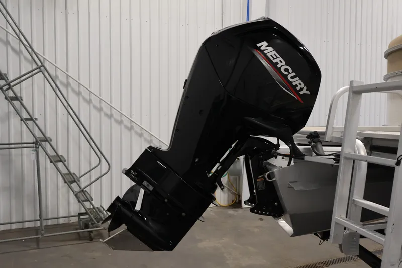 Slide: The Image of 2021 Lowe SS 230 WT boat with Mercury outboard motor in a garage setting. - 41