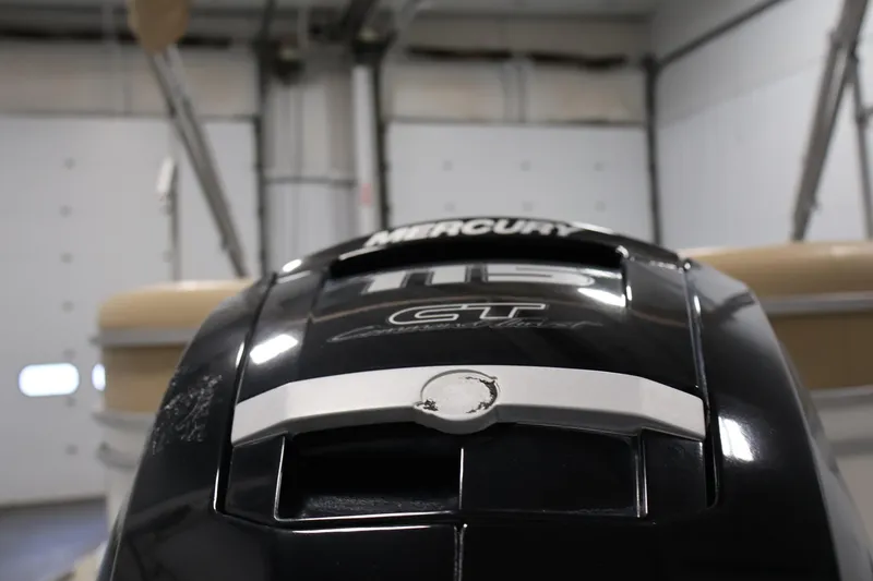 Slide: The Image of 2021 Lowe SS 230 WT boat with Mercury 115 CT engine in a garage. - 42