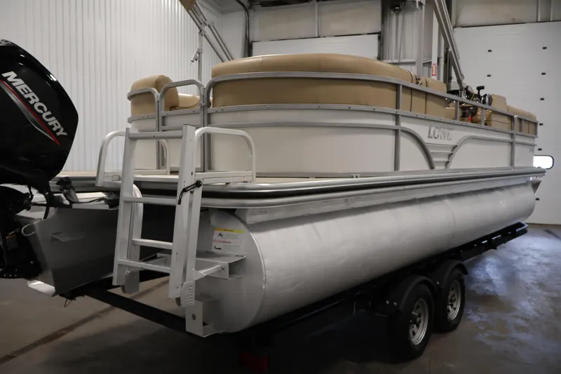 Slide: The Image of 2021 Lowe SS 230 WT pontoon boat on trailer in indoor storage. - 5