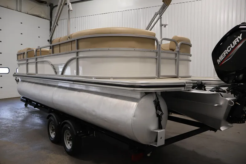 Slide: The Image of 2021 Lowe SS 230 WT pontoon boat with Mercury engine in a garage. - 7