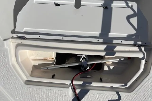 Slide: The Image of Open storage compartment on a 2006 Clearwater 2100 boat, showing interior details. - 5