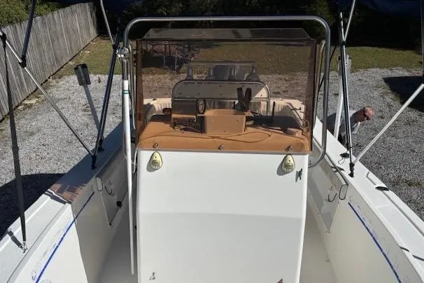 Slide: The Image of 2006 Clearwater 2100 boat with center console and protective windshield. - 8