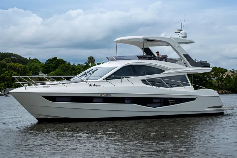 Slide: The Image of 2020 Galeon 550 Fly yacht on water, showcasing sleek design and modern features. - 1