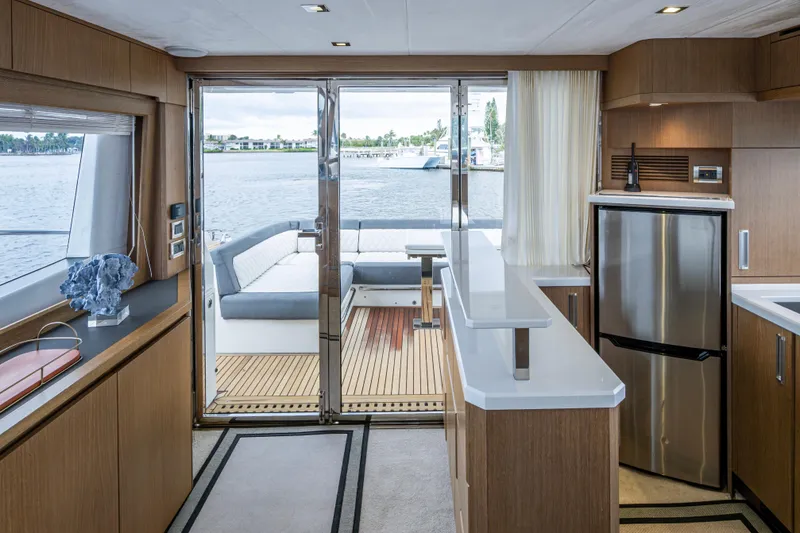 Slide: The Image of Interior of 2020 Galeon 550 Fly yacht with modern kitchen and waterfront view. - 10