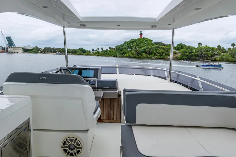 Slide: The Image of 2020 Galeon 550 Fly yacht interior with scenic waterway view. - 17