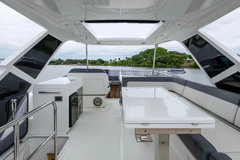 Slide: The Image of Luxurious 2020 Galeon 550 Fly yacht interior with sleek seating and modern amenities. - 19