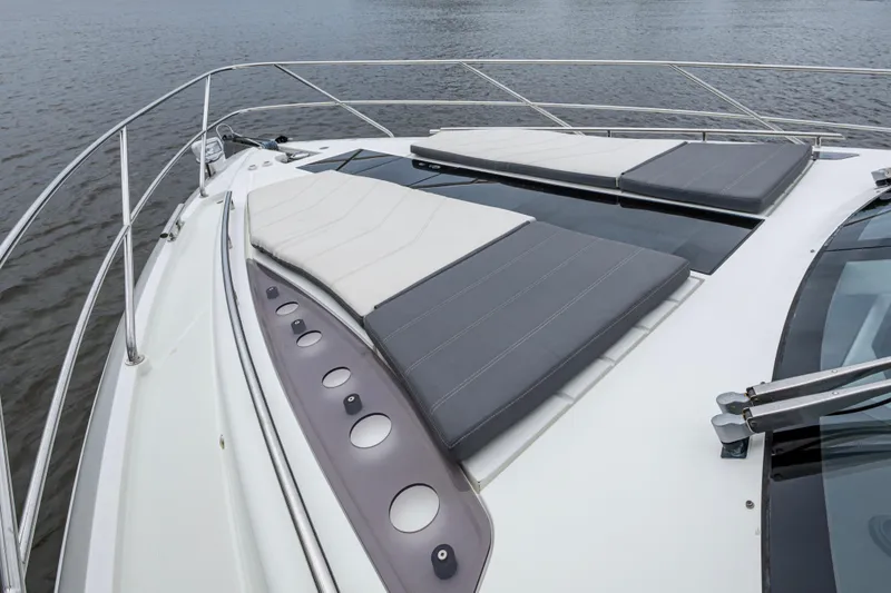 Slide: The Image of 2020 Galeon 550 Fly yacht with sunbathing pads on deck, cruising on water. - 24