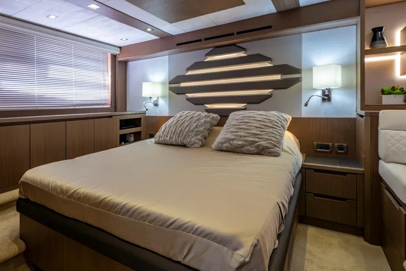 Slide: The Image of Luxurious bedroom interior of 2020 Galeon 550 Fly yacht with modern design elements. - 26