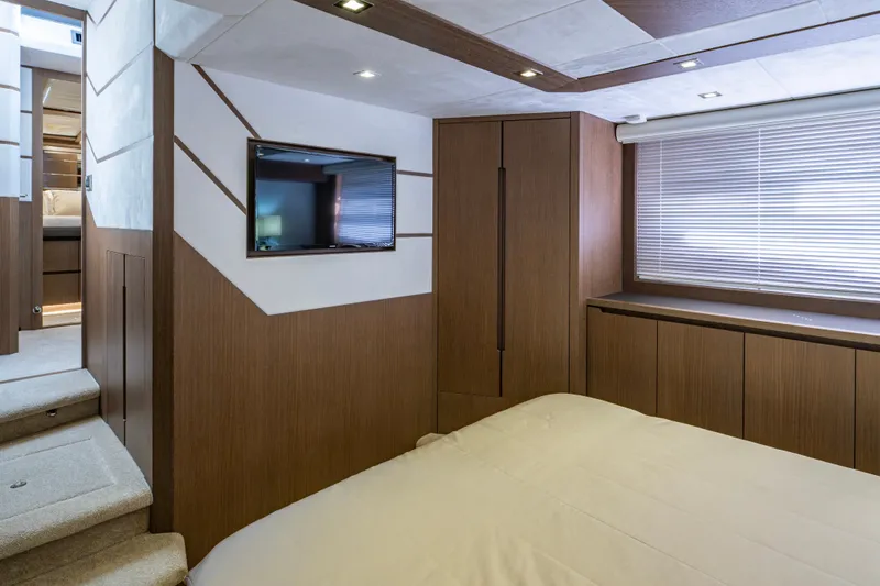Slide: The Image of Luxurious interior of 2020 Galeon 550 Fly yacht with modern wood finishes and TV. - 29