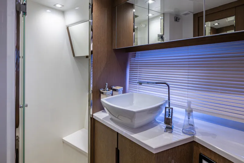 Slide: The Image of Luxurious bathroom interior of 2020 Galeon 550 Fly yacht with modern sink and lighting. - 38