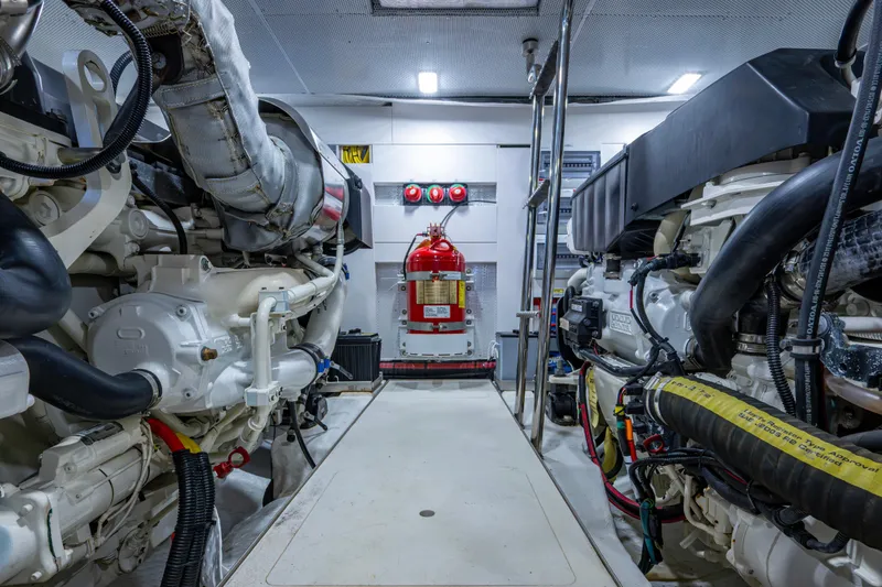 Slide: The Image of Engine room of 2020 Galeon 550 Fly yacht, featuring advanced machinery and fire extinguisher. - 44