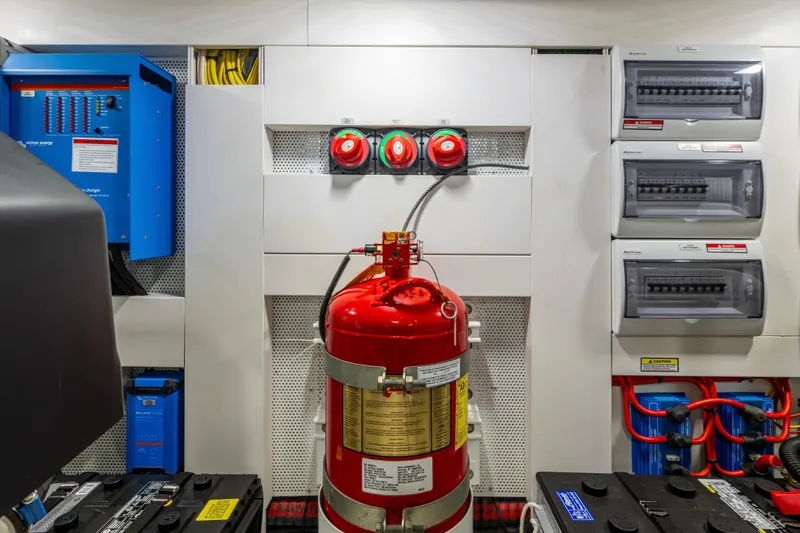 Slide: The Image of Engine room of 2020 Galeon 550 Fly yacht with fire extinguisher and electrical panels. - 46