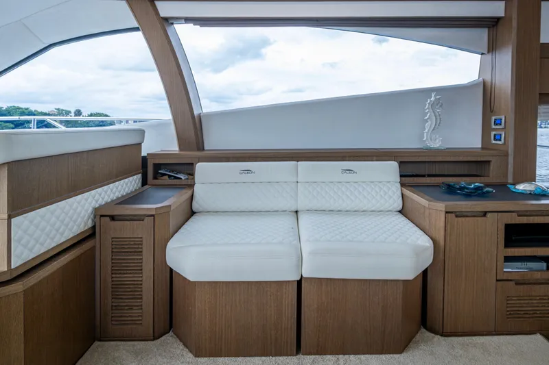 Slide: The Image of Luxurious interior of 2020 Galeon 550 Fly yacht with elegant seating and wood accents. - 6