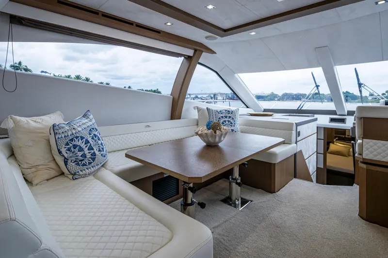 Slide: The Image of Luxurious interior of 2020 Galeon 550 Fly yacht with elegant seating and table. - 7