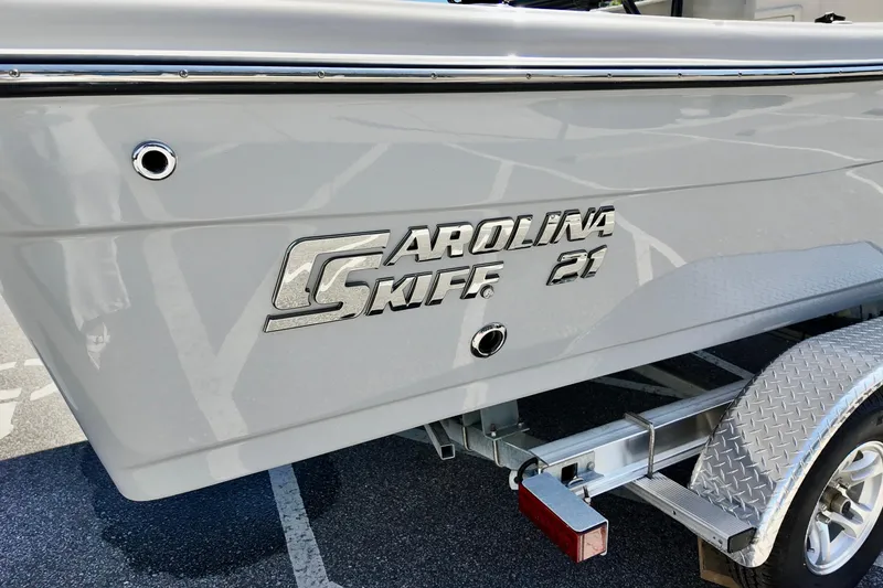 Slide: The Image of 2026 Carolina Skiff 21 Ultra Elite boat on trailer, side view. - 12