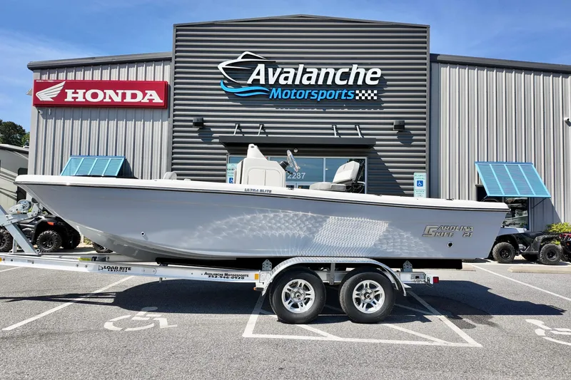 The Image of 2026 Carolina Skiff 21 Ultra Elite boat on trailer at Avalanche Motorsports. - 2