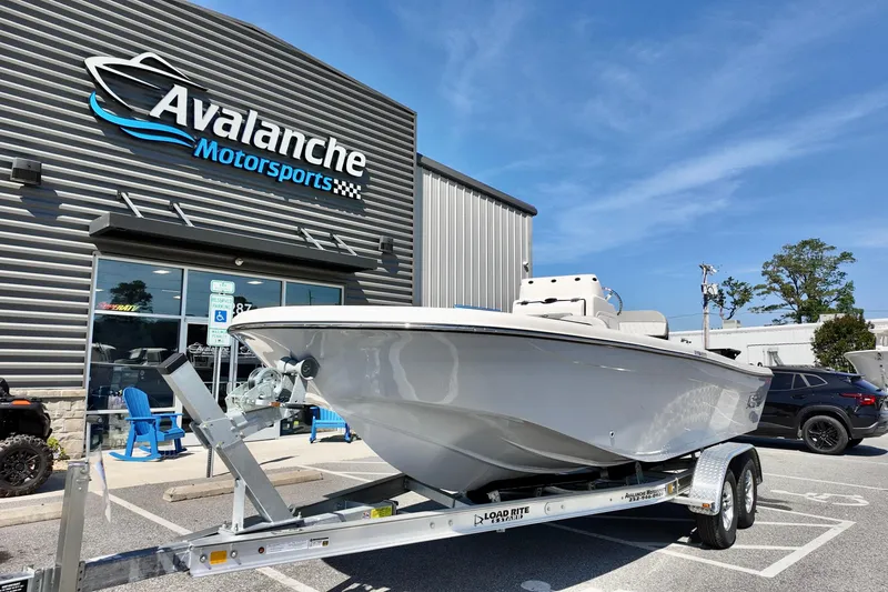 Slide: The Image of 2026 Carolina Skiff 21 Ultra Elite boat on trailer at Avalanche Motorsports dealership. - 3