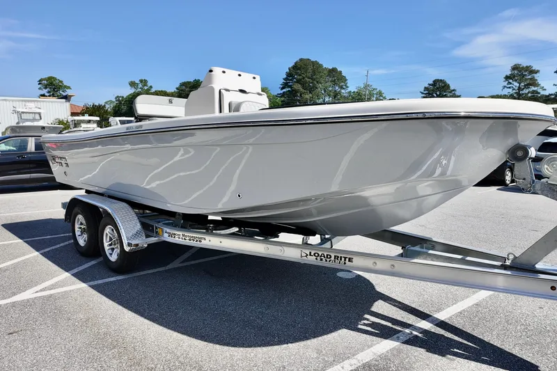 Slide: The Image of 2026 Carolina Skiff 21 Ultra Elite boat on a trailer in a parking lot. - 4