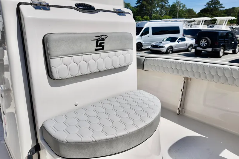 Slide: The Image of 2026 Carolina Skiff 21 Ultra Elite boat seating with hexagonal pattern upholstery. - 9
