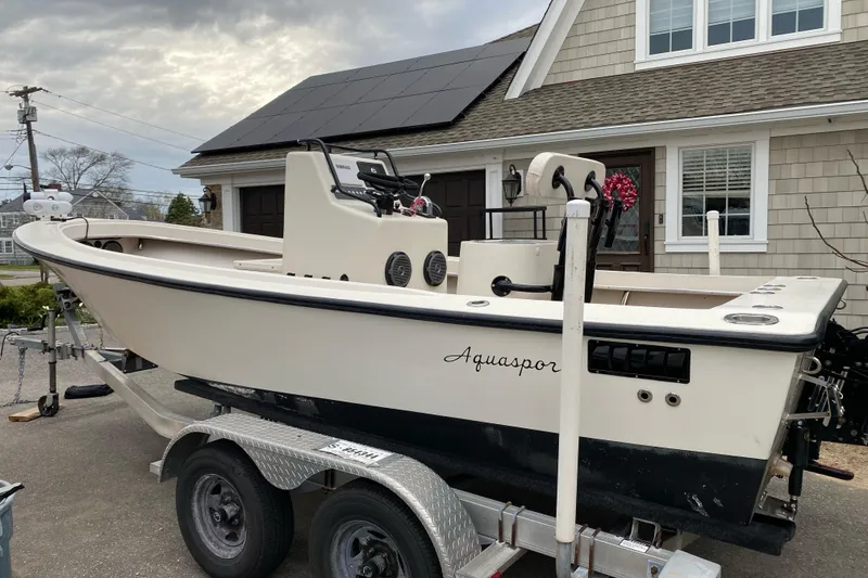 Slide: The Image of 1973 Aquasport 190 Osprey boat on trailer, parked in residential driveway. - 3