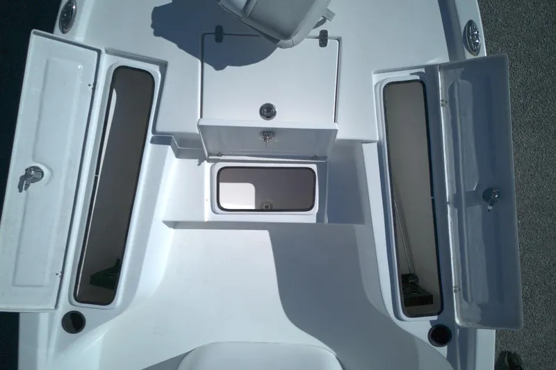 Slide: The Image of 2022 Blazer Bay 2200 boat deck with open storage compartments. - 5