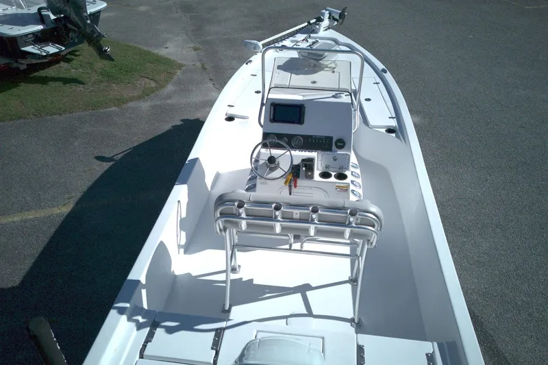 Slide: The Image of 2022 Blazer Bay 2200 boat interior with steering console and seating. - 9