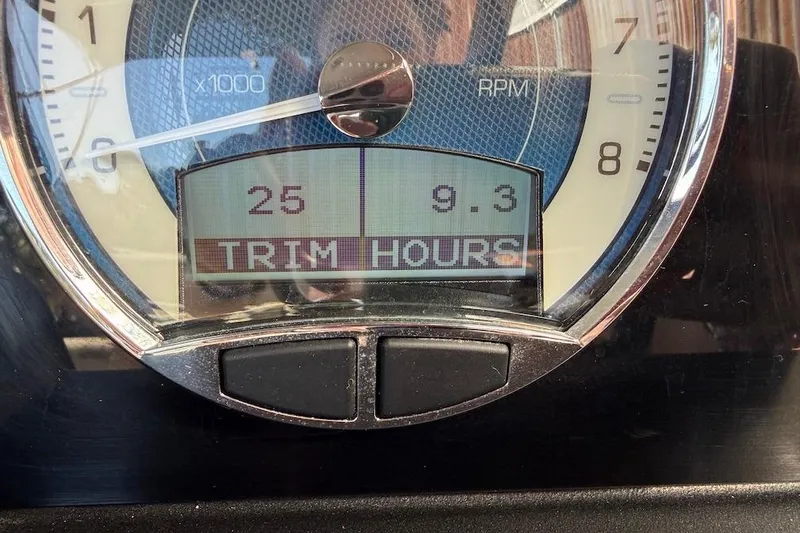 Slide: The Image of Close-up of Barletta L23UCA 2022 boat gauge displaying RPM and trim hours. - 10