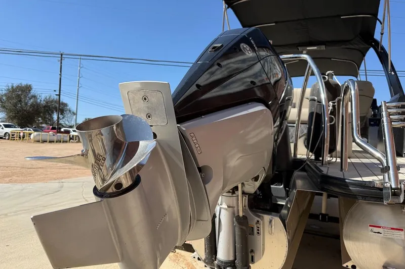 Slide: The Image of 2022 Barletta L23UCA boat with powerful outboard motor and sleek design. - 5