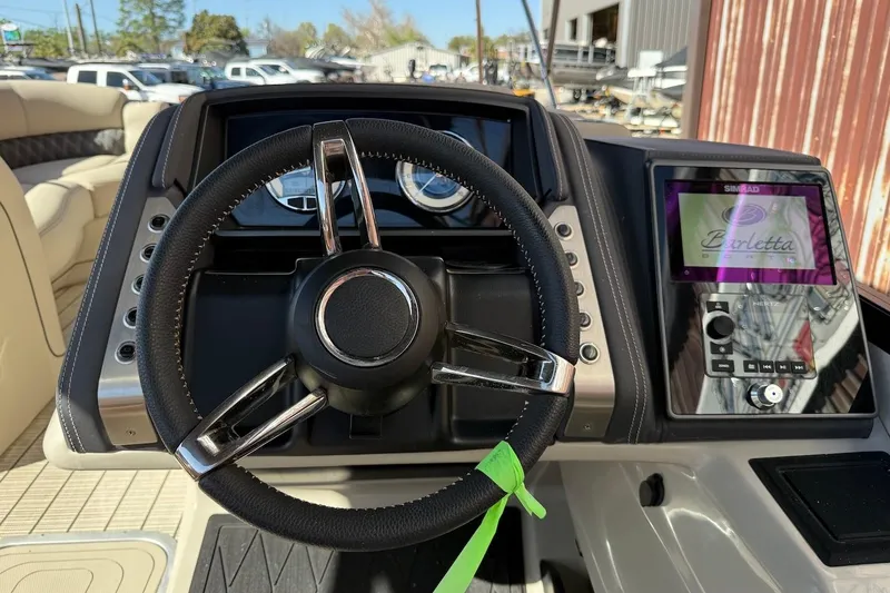 Slide: The Image of Steering console of 2022 Barletta L23UCA boat with digital display and controls. - 9