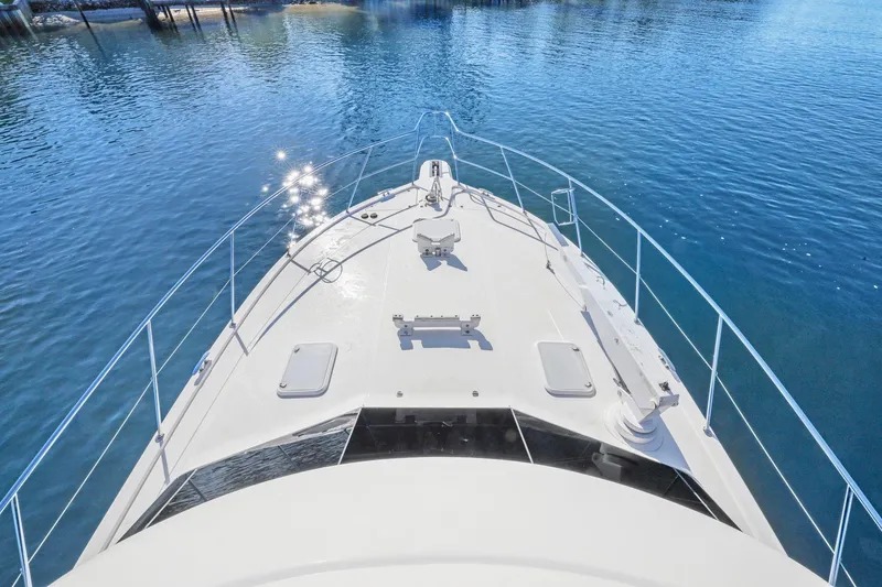 Slide: The Image of 2016 Riviera 43 Open Flybridge yacht on calm water, viewed from above. - 16