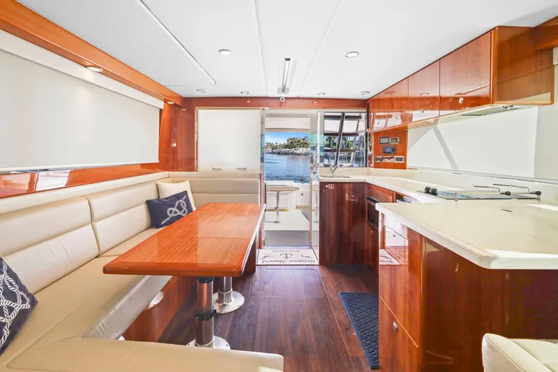 Slide: The Image of Luxurious interior of 2016 Riviera 43 Open Flybridge yacht with elegant wood finishes. - 28