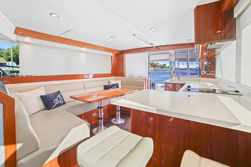 Slide: The Image of Luxurious interior of 2016 Riviera 43 Open Flybridge yacht with elegant seating and dining area. - 29