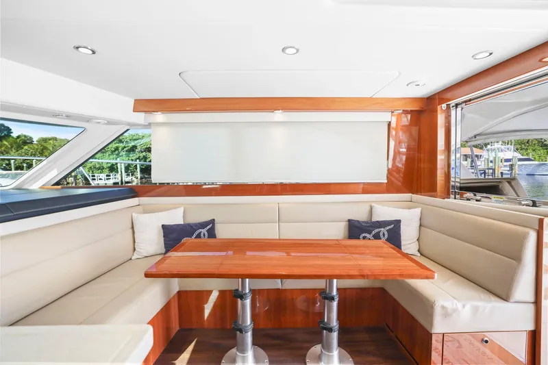 Slide: The Image of Luxurious interior of 2016 Riviera 43 Open Flybridge yacht with elegant seating and table. - 30