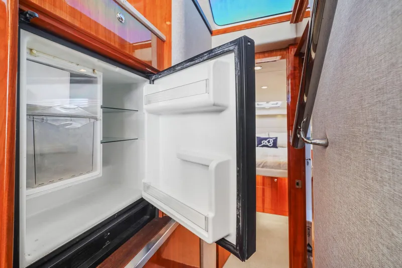 Slide: The Image of Open refrigerator inside 2016 Riviera 43 Open Flybridge yacht interior. - 35