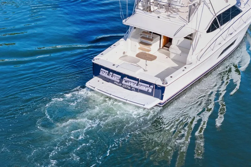 Slide: The Image of 2016 Riviera 43 Open Flybridge yacht cruising on blue water. - 4