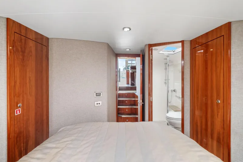 Slide: The Image of Luxurious interior of 2016 Riviera 43 Open Flybridge yacht with wood accents and modern amenities. - 41