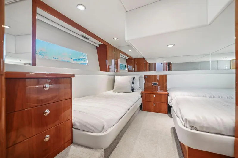 Slide: The Image of Luxurious 2016 Riviera 43 Open Flybridge cabin with twin beds and elegant wood finishes. - 42