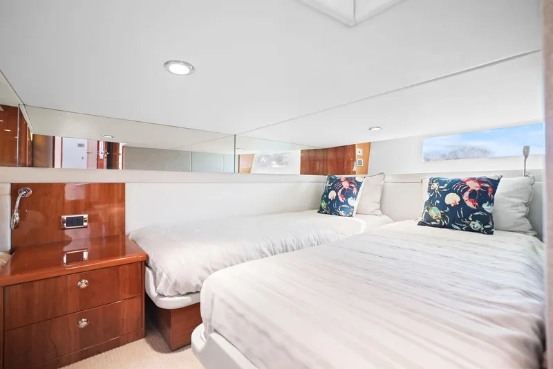 Slide: The Image of Luxurious twin cabin interior of 2016 Riviera 43 Open Flybridge yacht. - 44