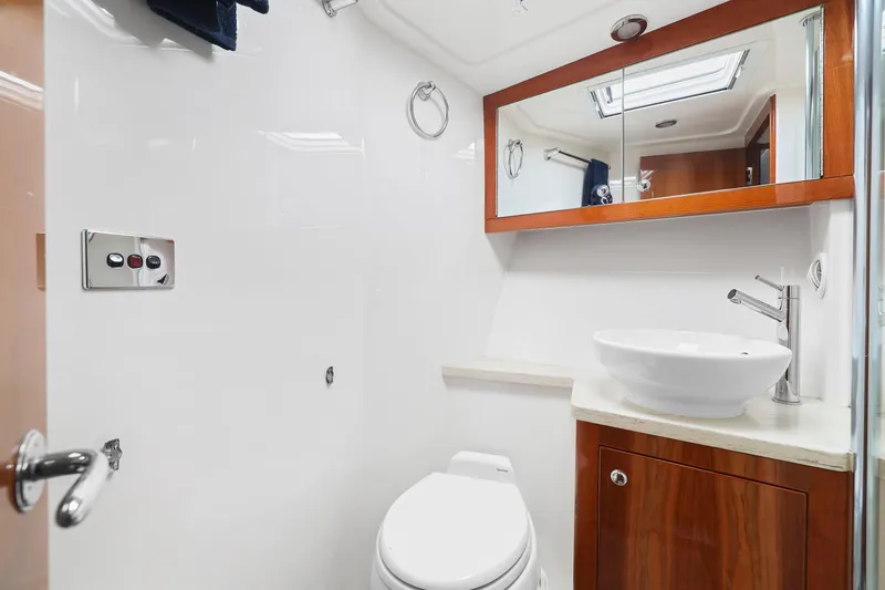 Slide: The Image of Luxurious bathroom in 2016 Riviera 43 Open Flybridge yacht with modern fixtures. - 46