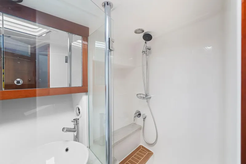 Slide: The Image of Luxurious bathroom in 2016 Riviera 43 Open Flybridge yacht with modern shower amenities. - 48