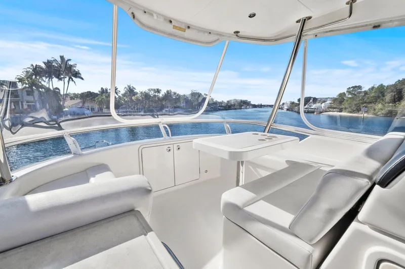 Slide: The Image of 2016 Riviera 43 Open Flybridge interior with scenic waterfront view. - 50