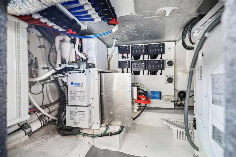 Slide: The Image of Engine room of 2016 Riviera 43 Open Flybridge with electrical systems and wiring. - 58