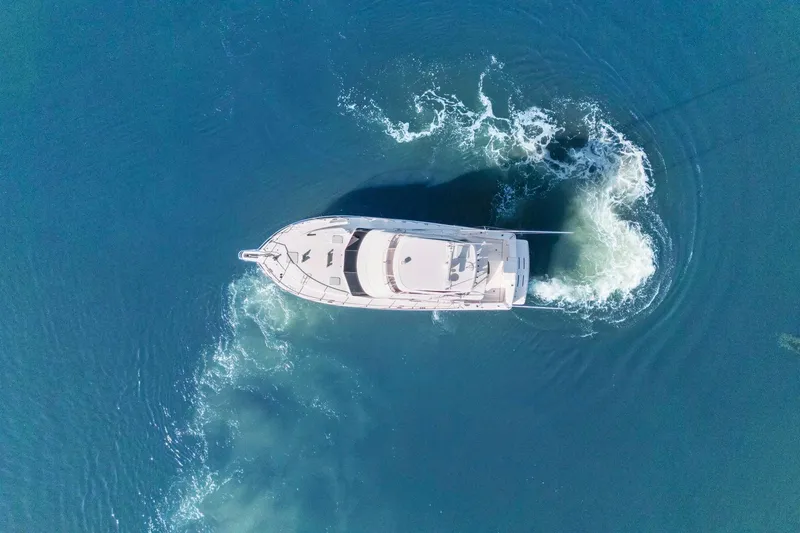Slide: The Image of Aerial view of 2016 Riviera 43 Open Flybridge yacht navigating blue waters. - 8