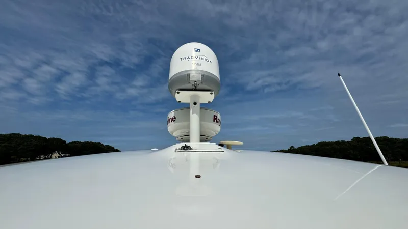 Slide: The Image of Radar antenna on Chaparral Signature 350 boat, 2007 model, under blue sky. - 29