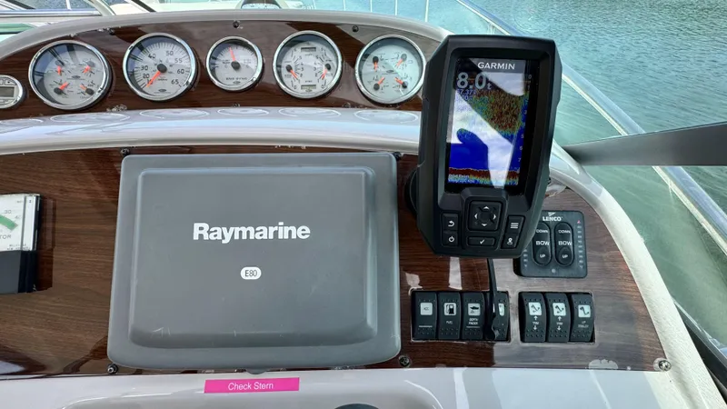 Slide: The Image of Dashboard of a 2007 Chaparral Signature 350 with Raymarine and Garmin devices. - 31